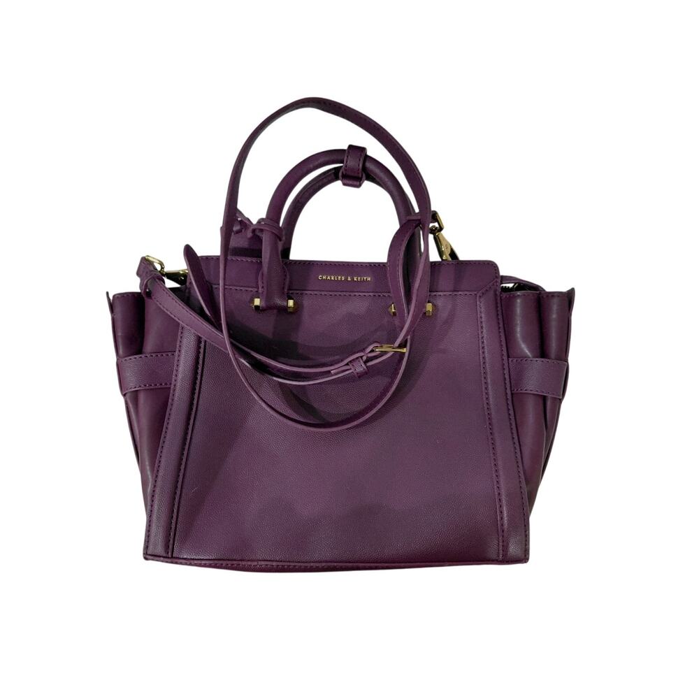 Charles and Keith trapeze purple purse.